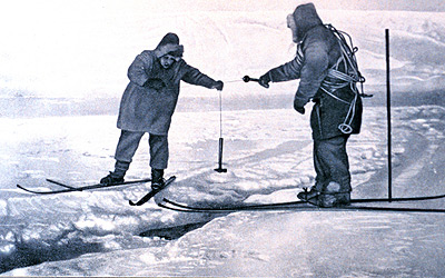 sounding the depth through a crack in sea ice