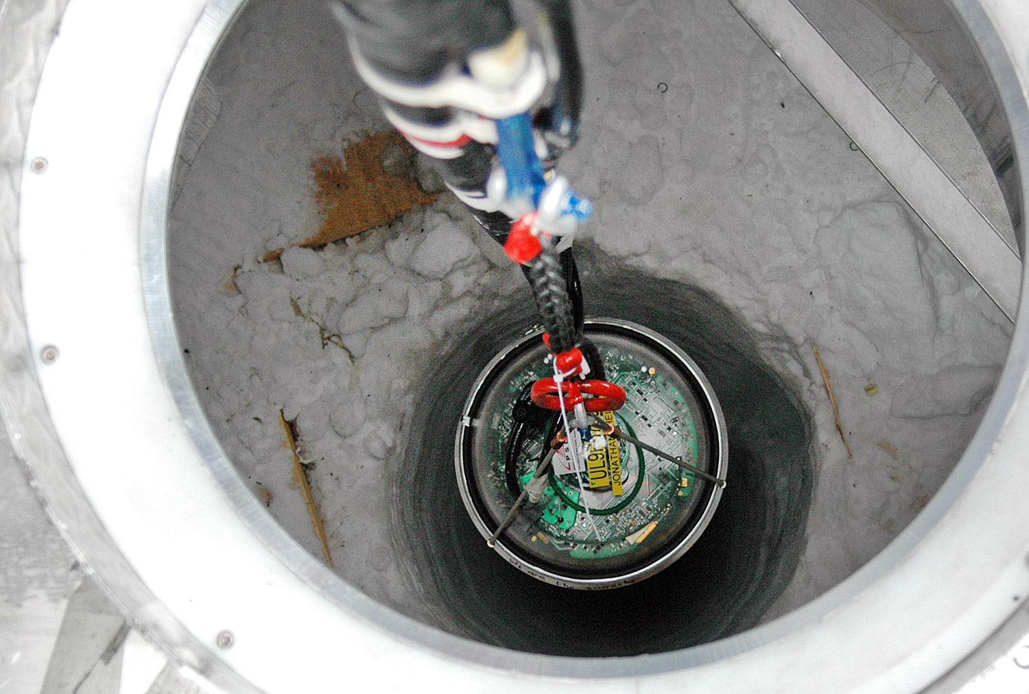 DOM being deployed in a drilled shaft in the ice