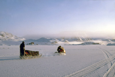 Skidoo and Sledge Loaded with Tent and Camping Equipment